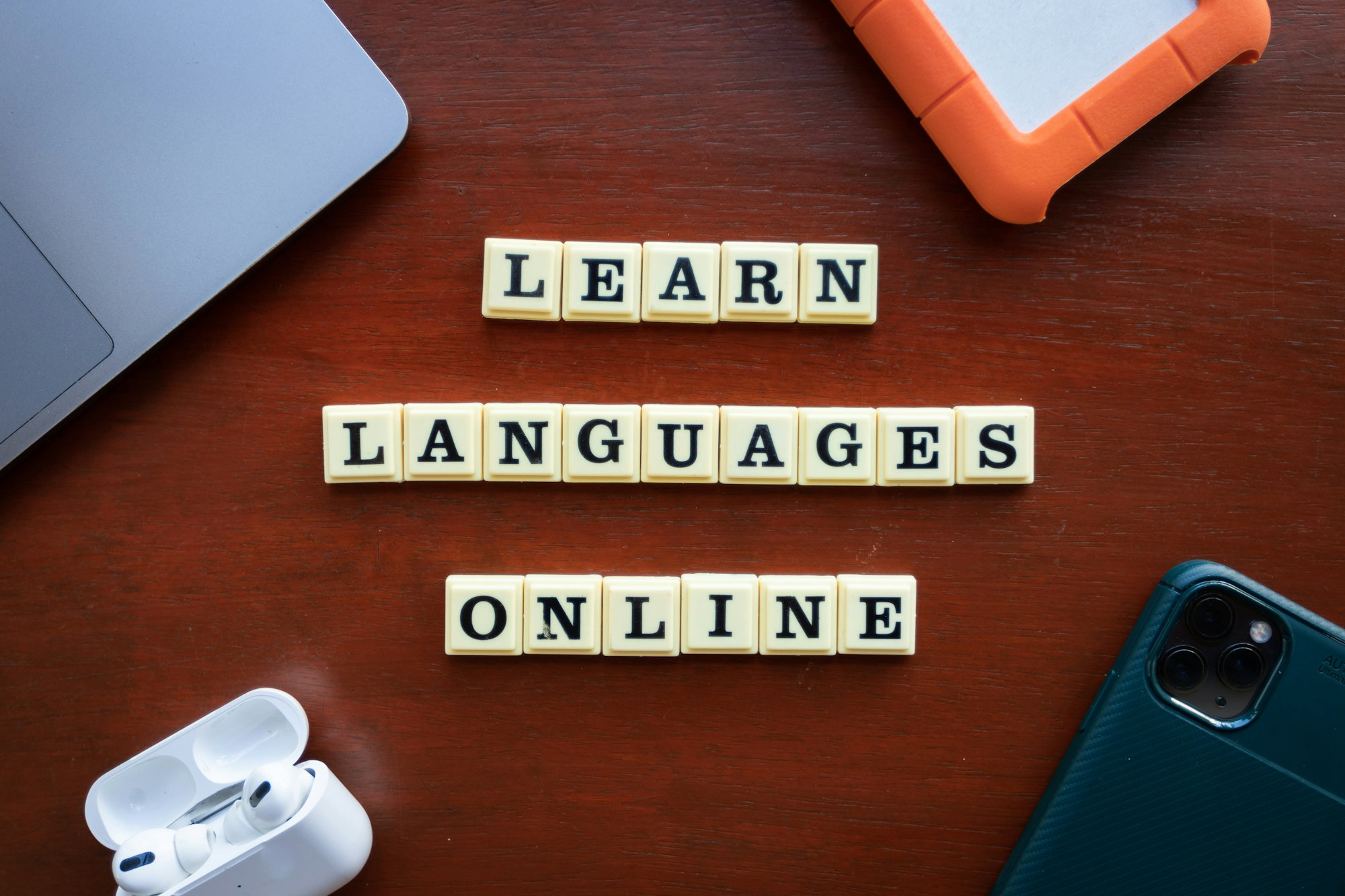 scrabble-tiles-spelling-learn-languages-on-a-table.jpg scrabble tiles spelling learn languages on a table
